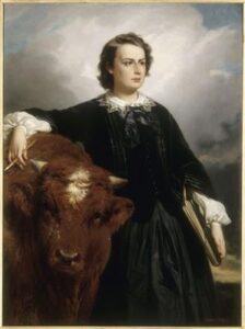 Portrait of Marie-Rosalie dite Rosa Bonheur. Édouard Dubufe painted the portrait of Rosa Bonheur next to a bull painted by the model.