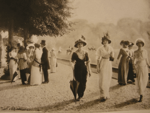 ladies walking in a garden at belle époque