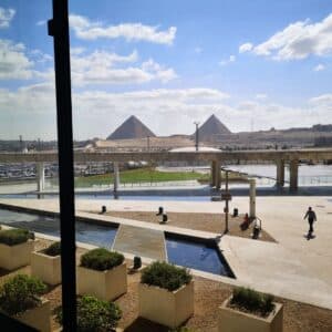Image of the Grand Egyptian Museum with the pyramids of Cheops